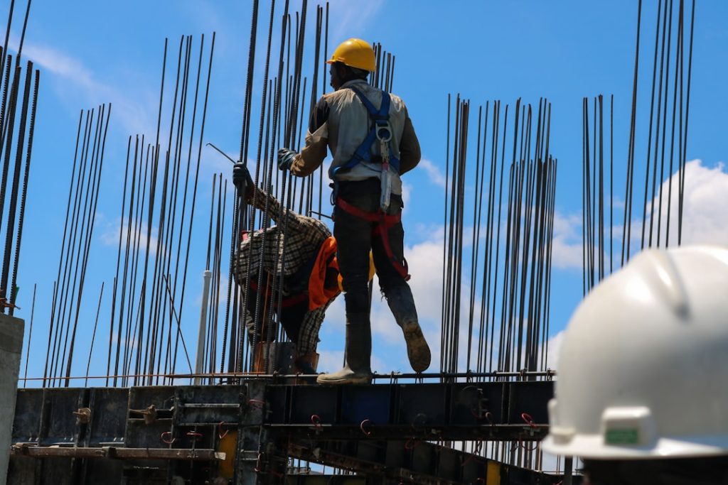 a-man-standing-on-top-of-a-metal-structure-2dk-cp-wauw
