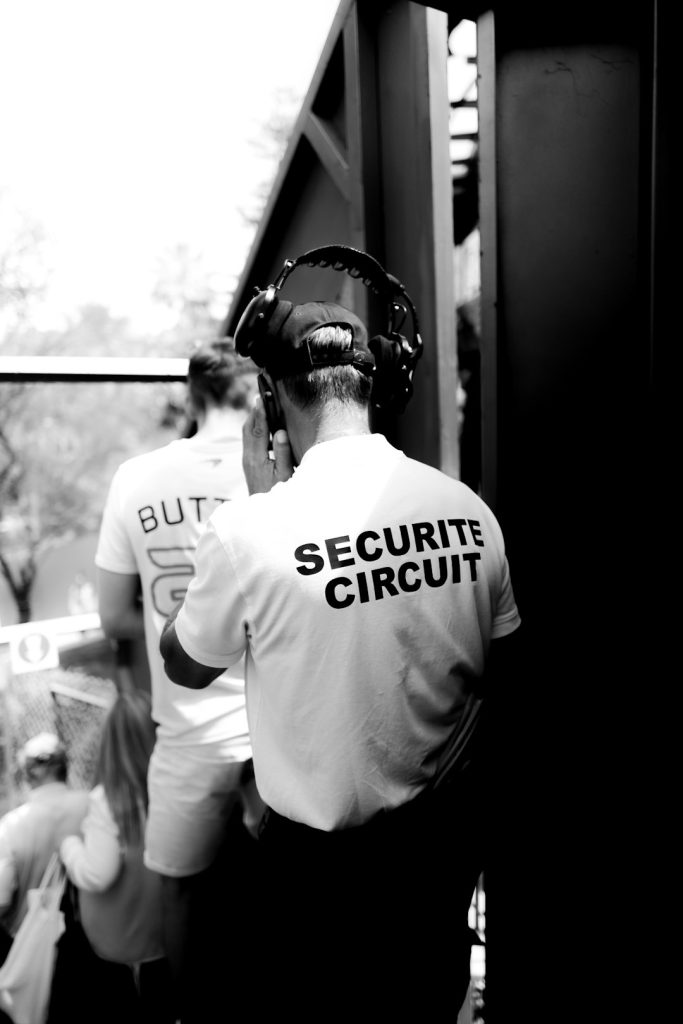 security-personnel-with-headphones-grayscale-photo-lua0lr28phe